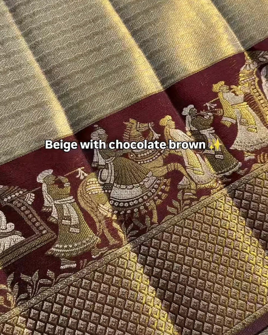 Textile with beige and chocolate brown patterns and designs.